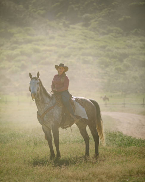 istock Cowgirl Horseback Riding 1040018560