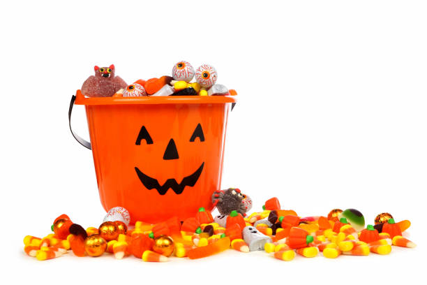 istock Halloween Jack o Lantern candy collector with candy over white 1040023050