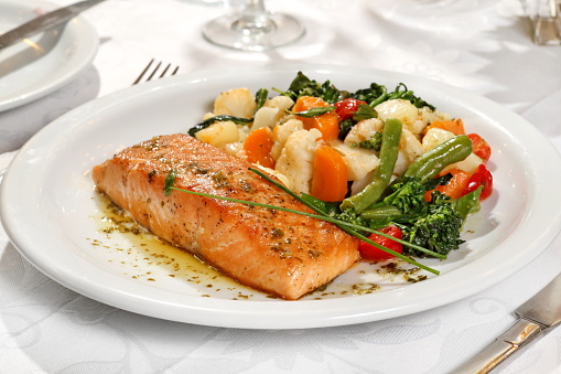 salmon with vegetables on the plate