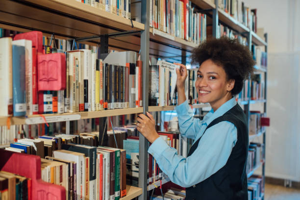 istock Smiling woman in the library 1040027768