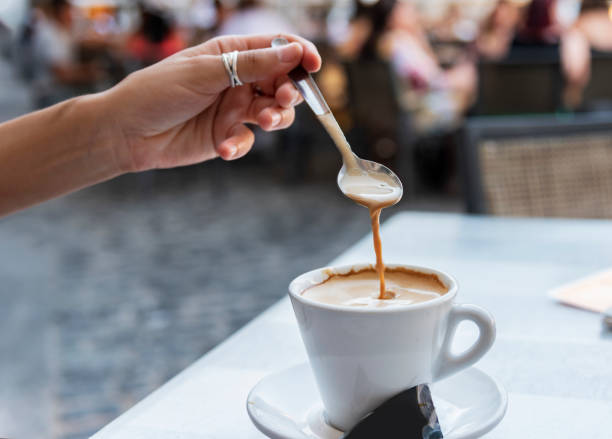 istock Young woman stirring a coffee 1040032264