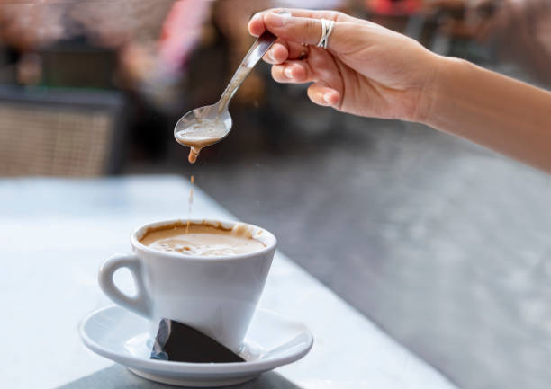istock Young woman stirring a coffee 1040032270