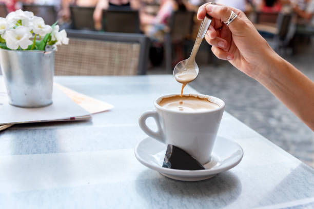 istock Young woman stirring a coffee 1040032272