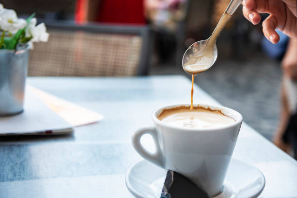 istock Young woman stirring a coffee 1040032278