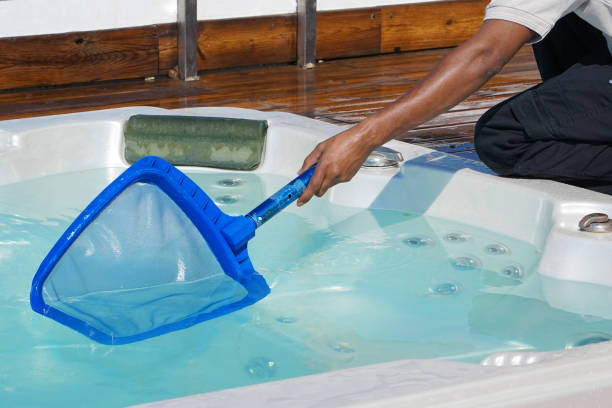 istock Hotel staff worker cleaning the pool. Maintenance. 1040032322