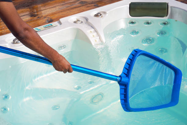istock Hotel staff worker cleaning the pool. Maintenance. 1040032428