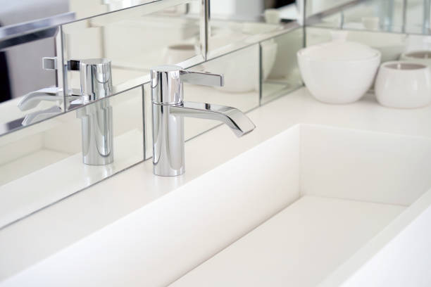 istock Modern white bathroom sink with faucet 1040034982