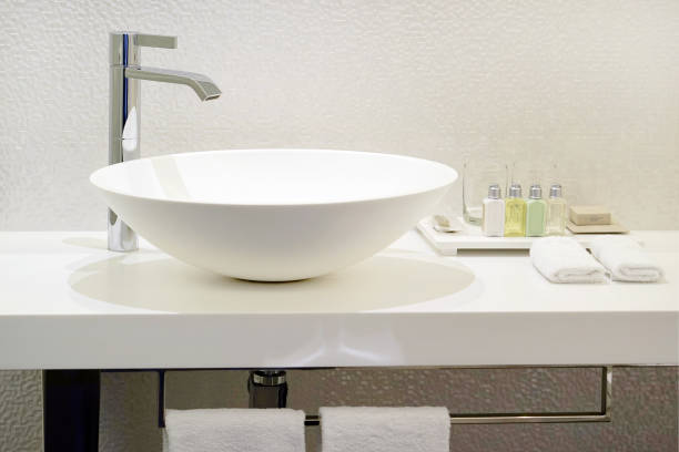 istock Modern white bathroom sink with faucet 1040037234