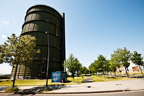 A colourful transformer covered in graffiti near a gigantic tank at Hochofenplatz - a decommissioned steel factory (since 1998) In Phoenix West, Dortmund - Germany