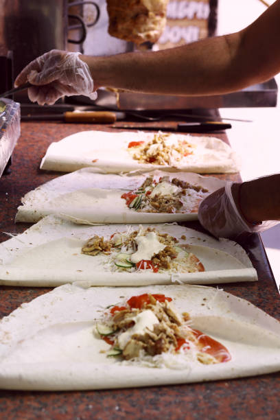 istock Hands of a professional chef who makes Shawarma 1040054914