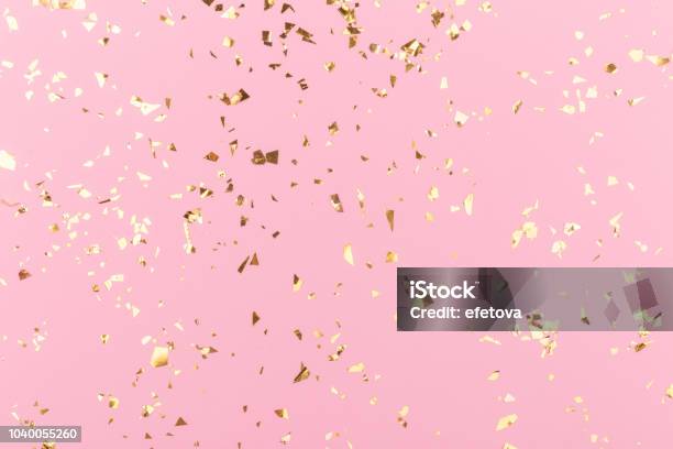 Golden Sparkles On Pink Stock Photo - Download Image Now - Confetti, Backgrounds, Pink Color