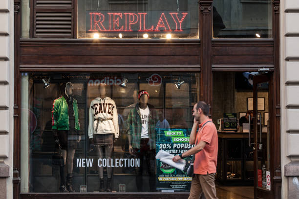 Replay Jeans logo in front of their main store in Belgrade. Replay Jeans, part of the Italian group Fashion box, is a fashion retailer specialized in denim Picture of a sign with the Replay Jeans logo on their shop in Belgrade, Serbia. Replay is a brand of the Fashion Box Italian group, specialized in denim styling and production, creating, promoting and distributing casual wear, accessories and footwear for men, women and children. replay photos stock pictures, royalty-free photos & images