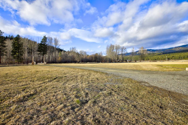 istock Fenced farm field with picturesque landscape. 1040078698