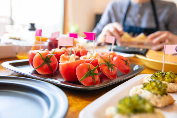 Woman preparing lunch for home party