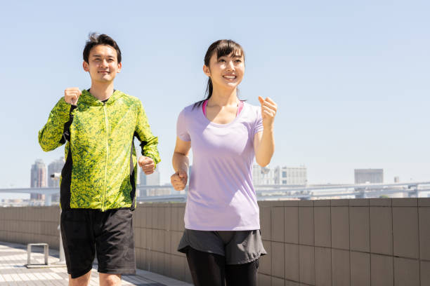 istock sporty asian people jogging 1040090078
