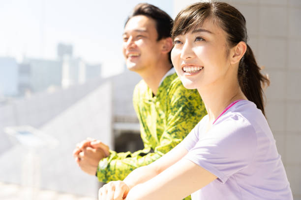 istock sporty asian people relaxing 1040090112