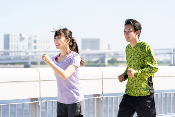 istock sporty asian people jogging 1040090282