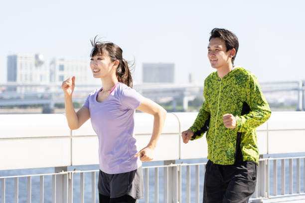 istock sporty asian people jogging 1040090290