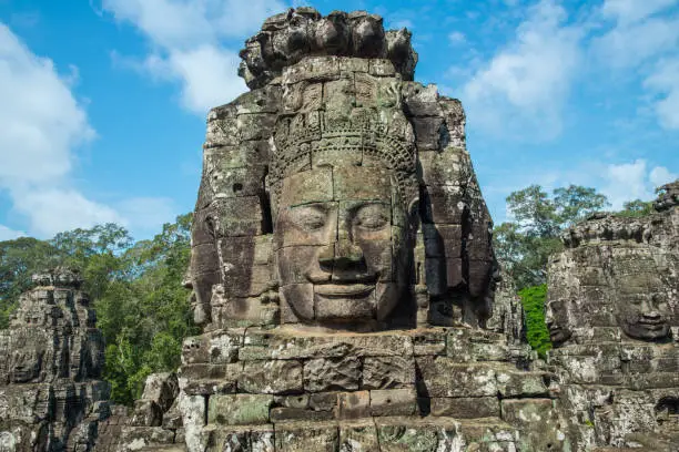 Photo of The mystery face towers in Bayon temple, temple of King Jayavarman VII. The faces were believed to represent Brahma, the Hindu God of creation but some believe that it is the King himself.