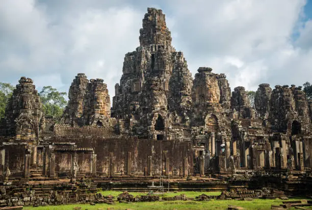 Photo of The scenery of Bayon temple, temple of King Jayavarman VII. It is a mountain temple built to represent Mount Meru, the center of the universe in Hindu and Buddhist cosmology.