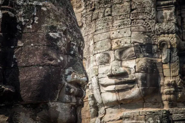 Photo of The mystery face towers in Bayon temple, temple of King Jayavarman VII. The faces were believed to represent Brahma, the Hindu God of creation but some believe that it is the King himself.