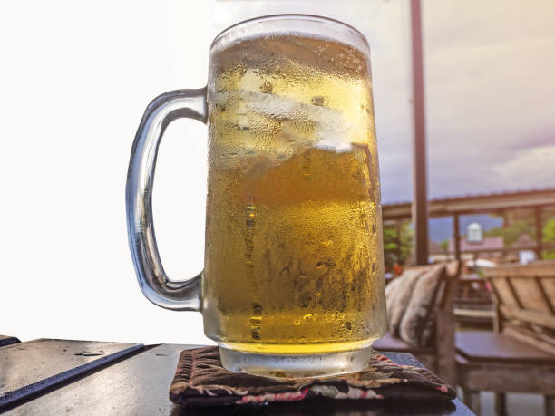 istock glass of beer on wood table. 1040152430
