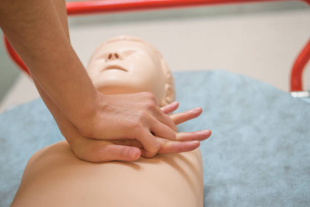 istock Young women's hands learn to do artificial respiration on plastic mannequin 1040163382