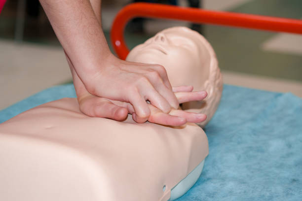 istock Young women's hands learn to do artificial respiration on plastic mannequin 1040163432