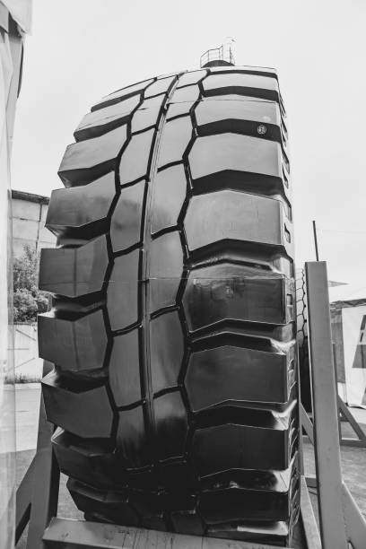 Big truck tire isolated on background.