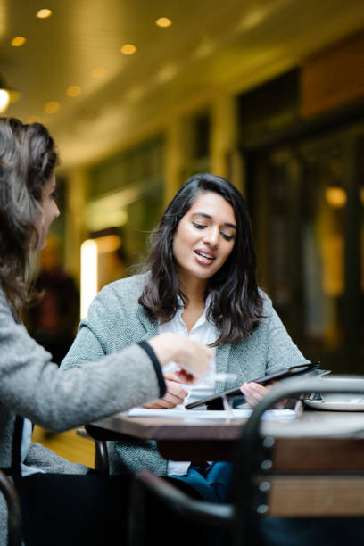 istock Businesswomen working at sidewalk cafe 1040170496