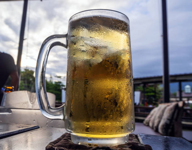 istock glass of beer in restaurant. 1040172836