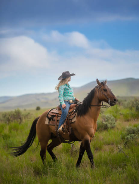 istock Cowgirl Horseback Riding 1040180370