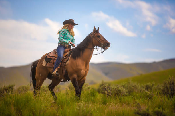 istock Cowgirl Horseback Riding 1040180558