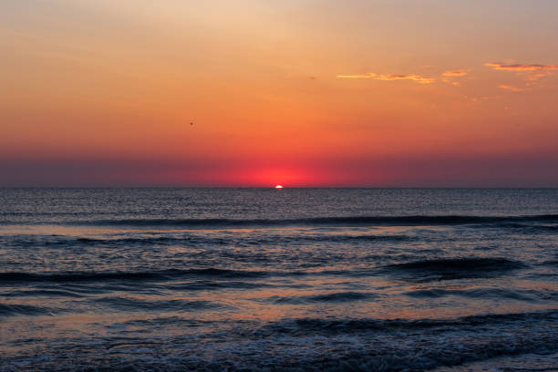 istock Amazing colorful sunrise at ocean 1040190746