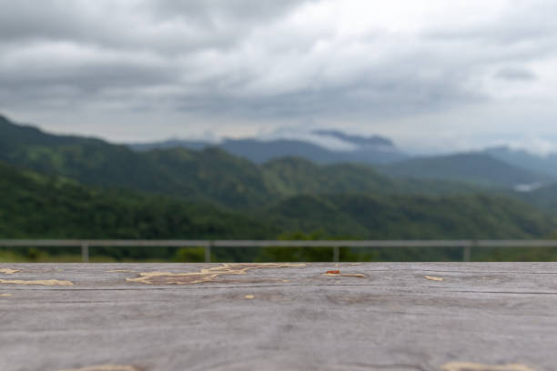 istock Empty wooden table with mountain natural background for product display template. 1040196856