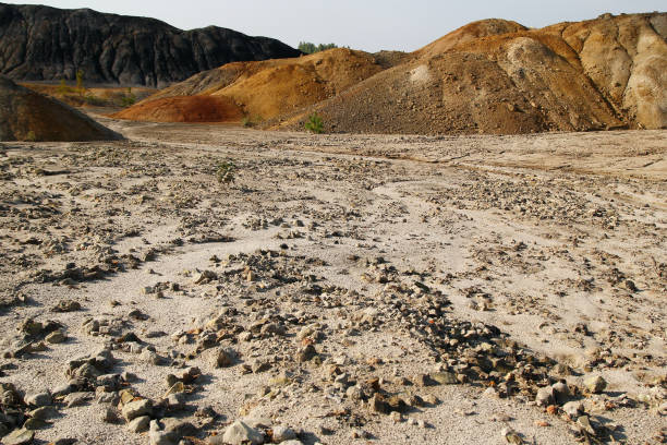 istock View on a dry polluted stony soil and hills in abandoned clay quarry. 1040209726