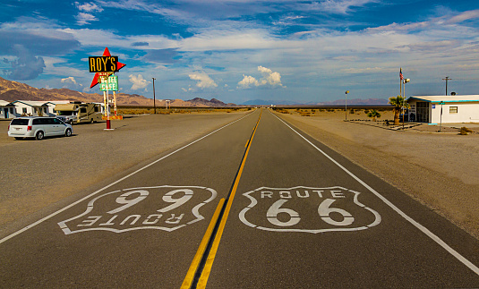 World famous and historic Route 66 signs on road at iconic Roy's Motel and Cafe in Amboy, California