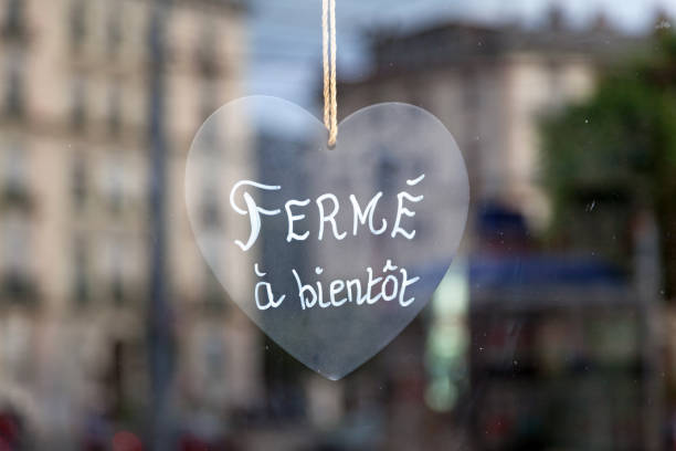 Close-up on a heart shaped sign saying in French \