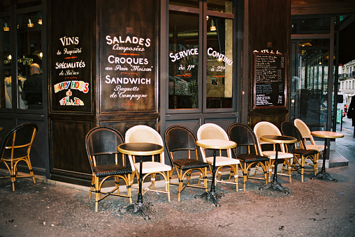 Empty tables and chairs outside a restaurant