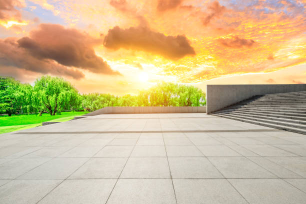 istock Empty square floor and green forest scenery at sunset 1040220326