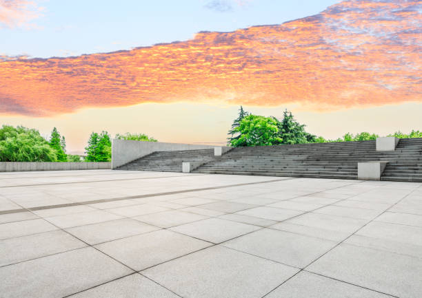 istock Empty square floor and green forest scenery at sunset 1040220998