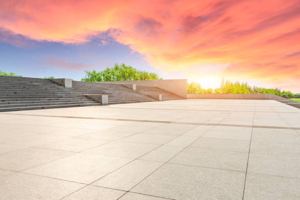 istock Empty square floor and green forest scenery at sunset 1040221156
