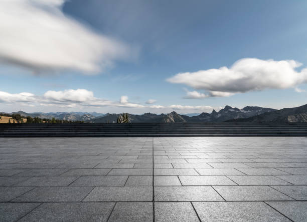 istock empty car park front of snow-capped mountains 1040221336