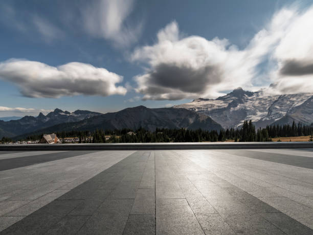 istock empty car park front of snow-capped mountains 1040221362