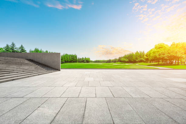 istock Empty square floor and green forest scenery at sunset 1040224894