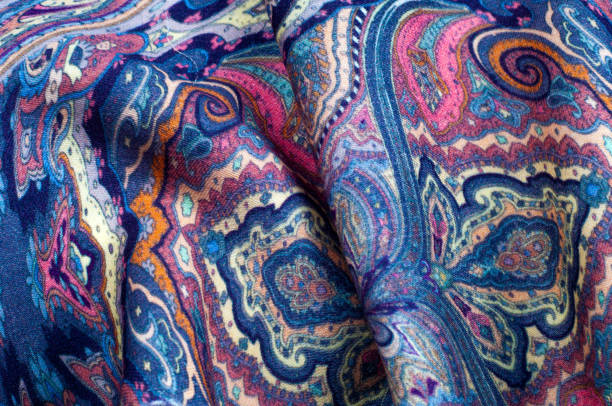 istock Background texture, pattern. paisley fabric of blue color with a floral pattern. Presenting a vibrant 70's power print that will revitalize your interior space. Soft with subtle texture 1040226142