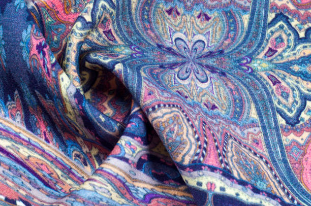 istock Background texture, pattern. paisley fabric of blue color with a floral pattern. Presenting a vibrant 70's power print that will revitalize your interior space. Soft with subtle texture 1040226322