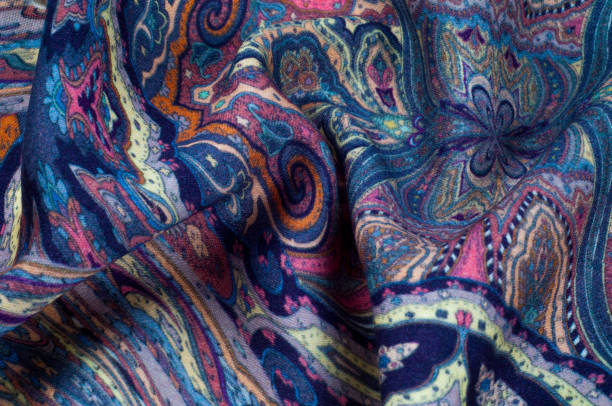 istock Background texture, pattern. paisley fabric of blue color with a floral pattern. Presenting a vibrant 70's power print that will revitalize your interior space. Soft with subtle texture 1040226402