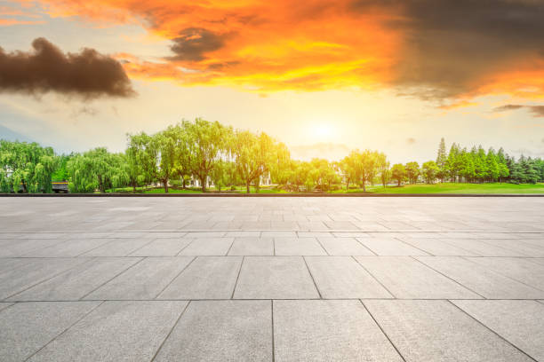 istock Empty square floor and green forest scenery at sunset 1040231234