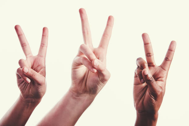 istock Three mixed hands giving enthusiastic V for victory signals 1040238188